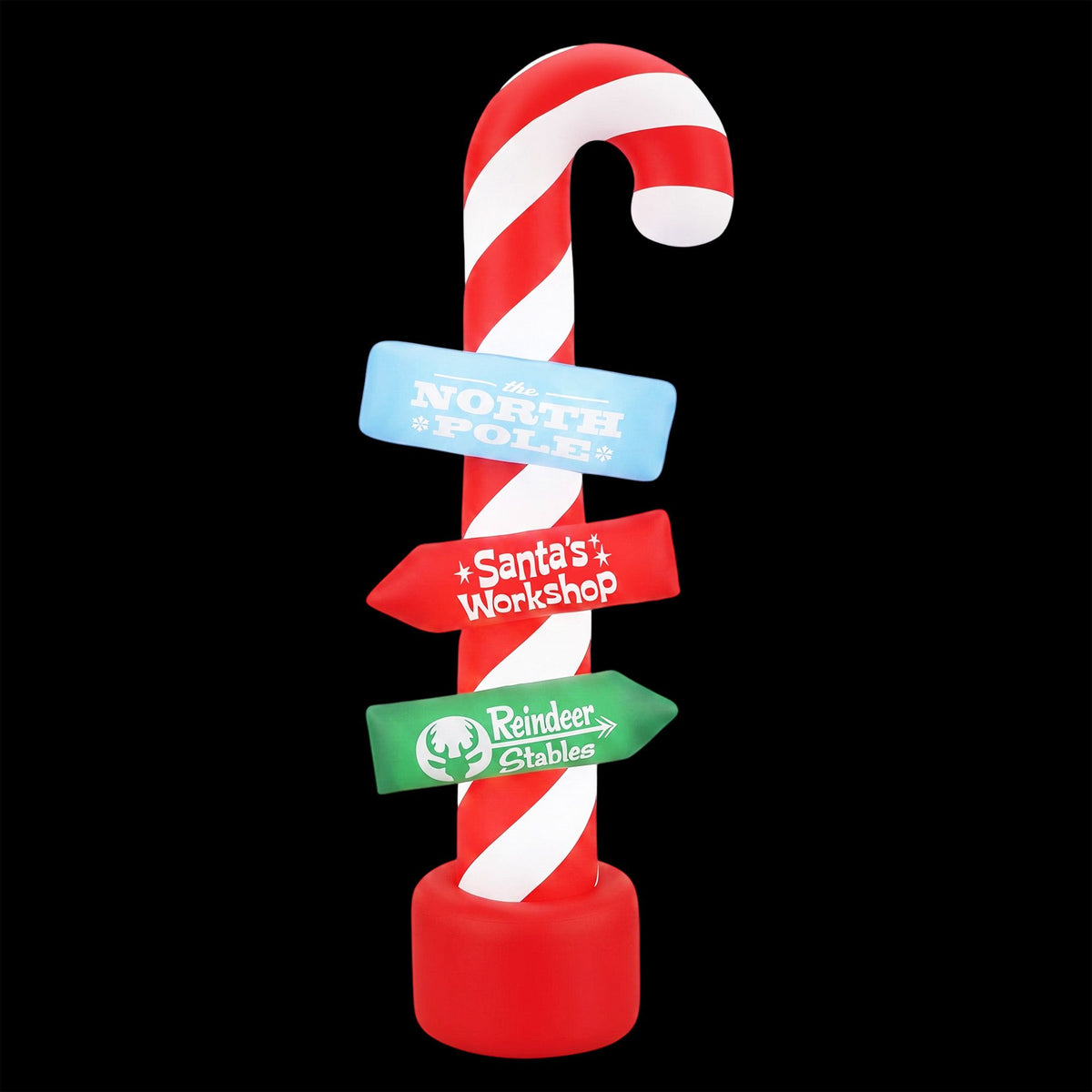 Inflatable candy pole with red base and red-white striped topper, Santa's Workshop banner