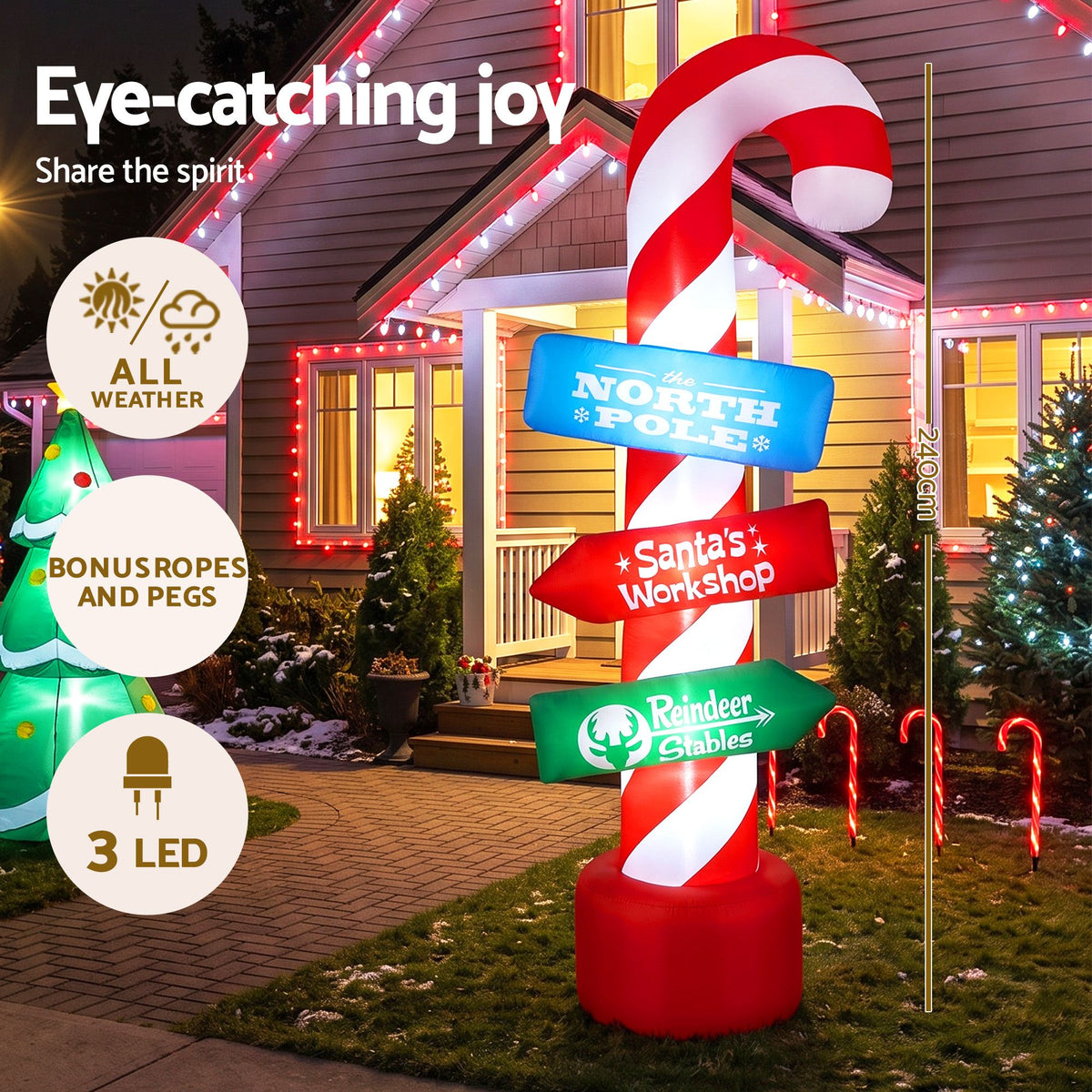 Inflatable candy pole with red base and candy-cane spiral column, North Pole and Santa signs