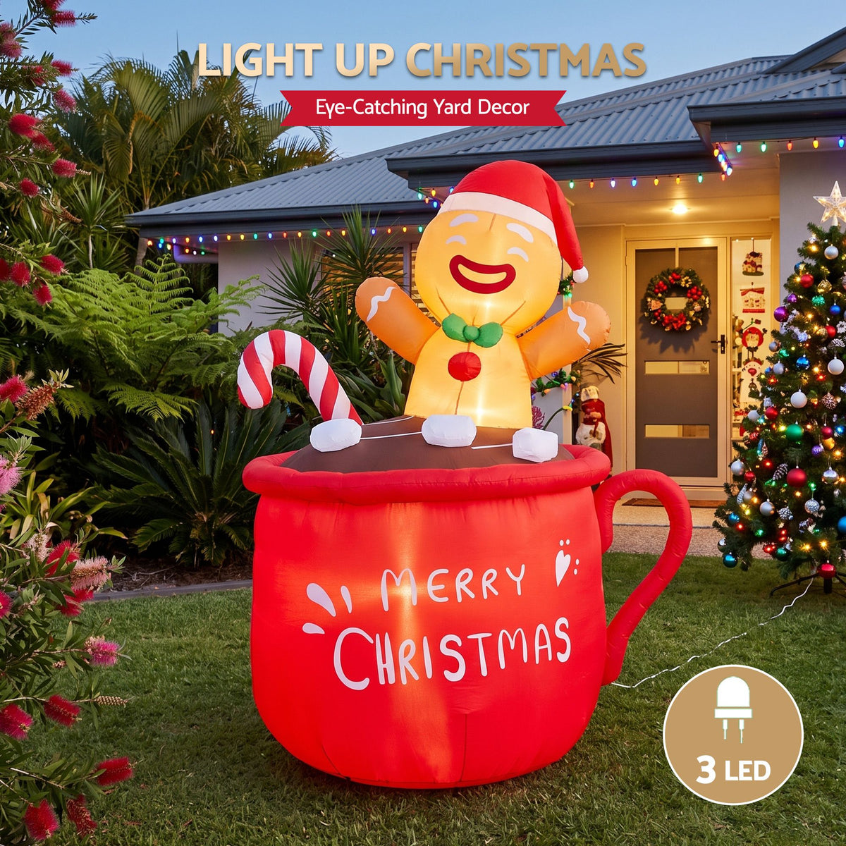 Lit inflatable red Christmas mug decoration with smiling gingerbread figure and candy cane