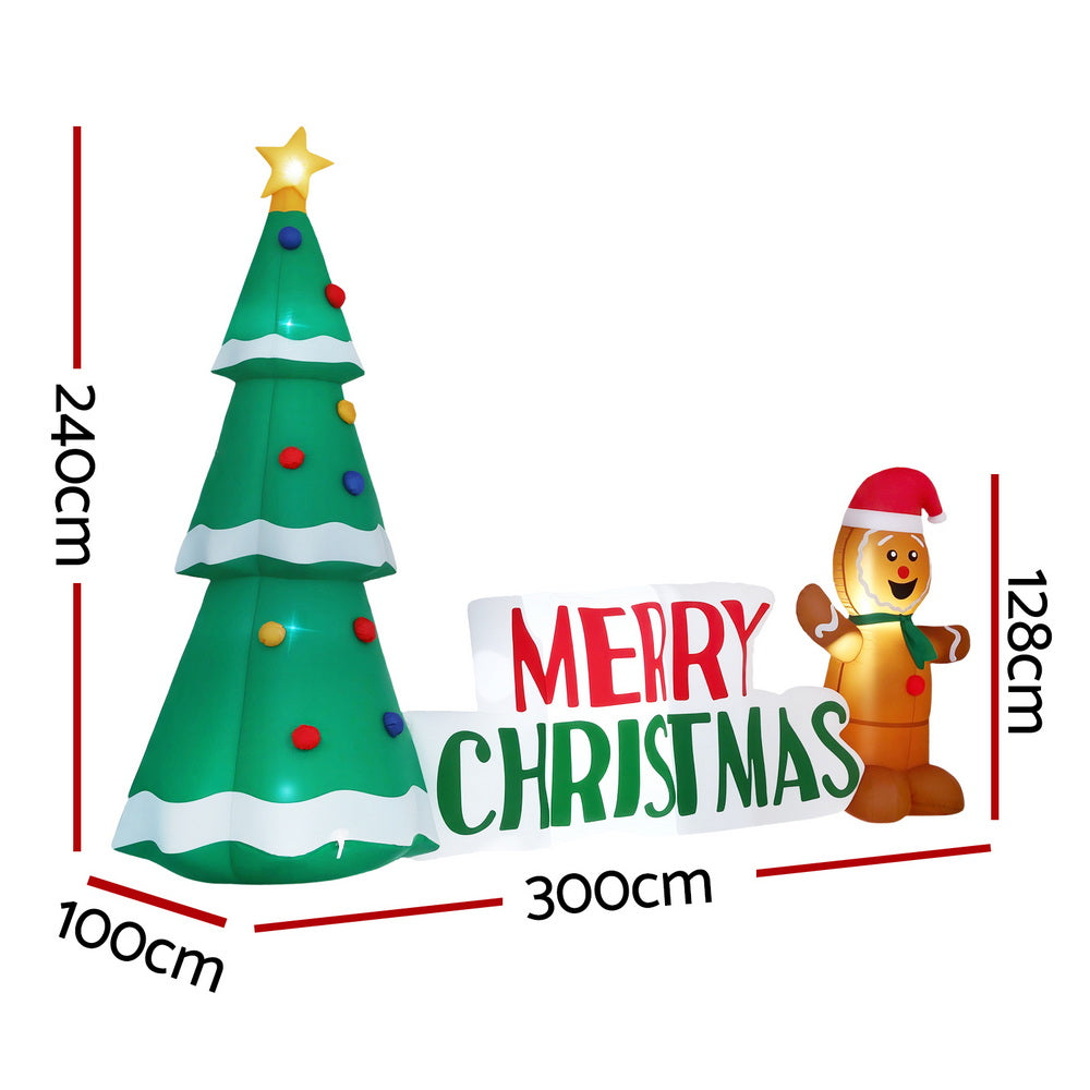 Inflatable green Christmas tree with Merry Christmas sign and gingerbread figure