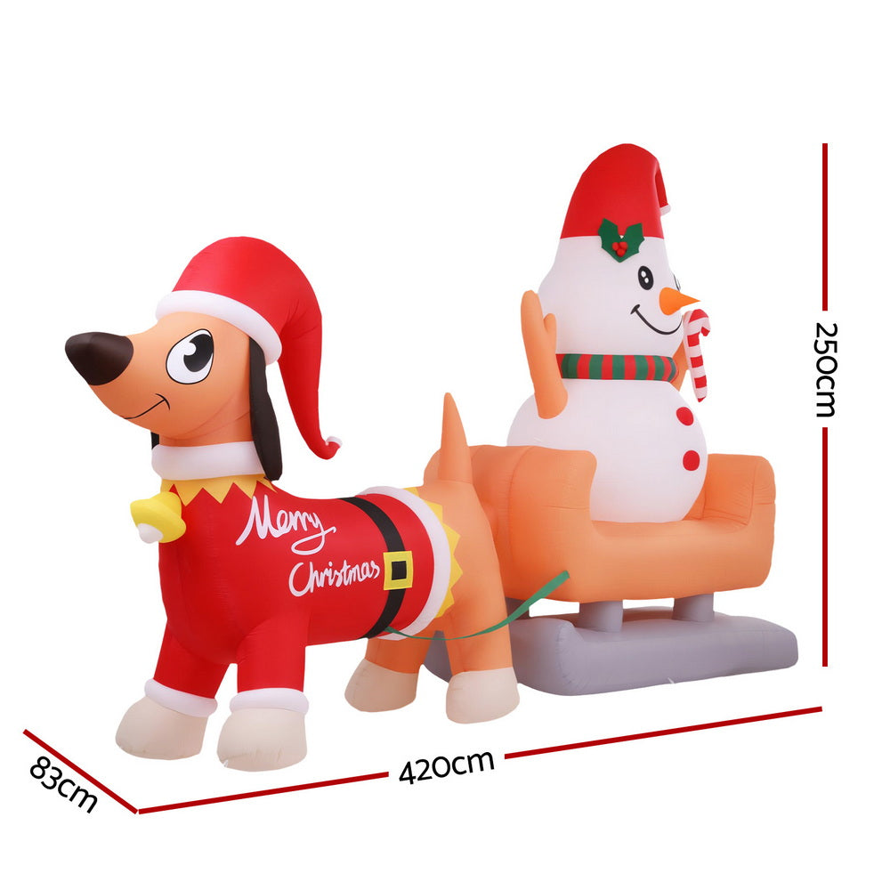Inflatable dog and snowman yard decoration with LED glow and striped candy cane