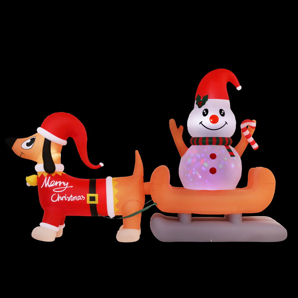 Inflatable dog and snowman decoration with LED-lit snowman and waving dog