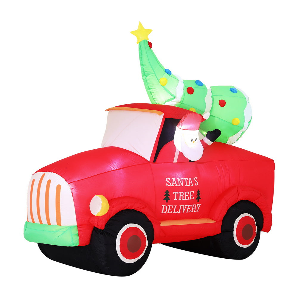 Inflatable Santa tree delivery truck with green tree on top and LED lights