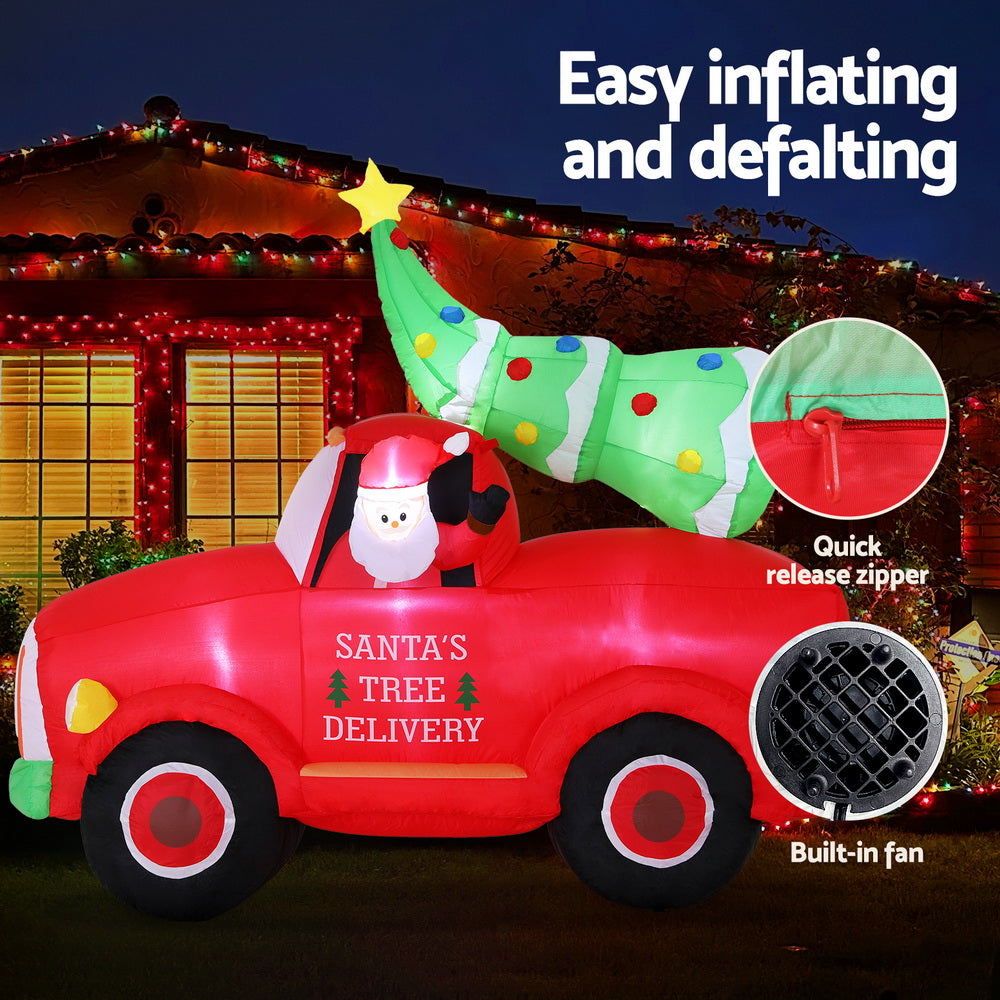 Inflatable Santa tree delivery truck with green topper, LED lights, and zipper access