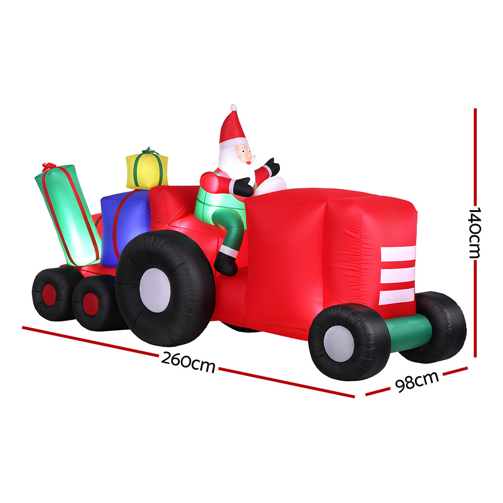 Inflatable Santa truck with red cab, green accents, large black tires; 26cm/98cm size shown