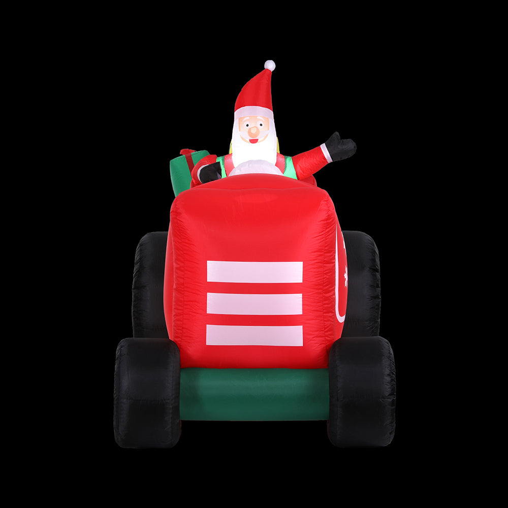 Front view inflatable Santa truck with red cab, green base, black side supports, and striped detail