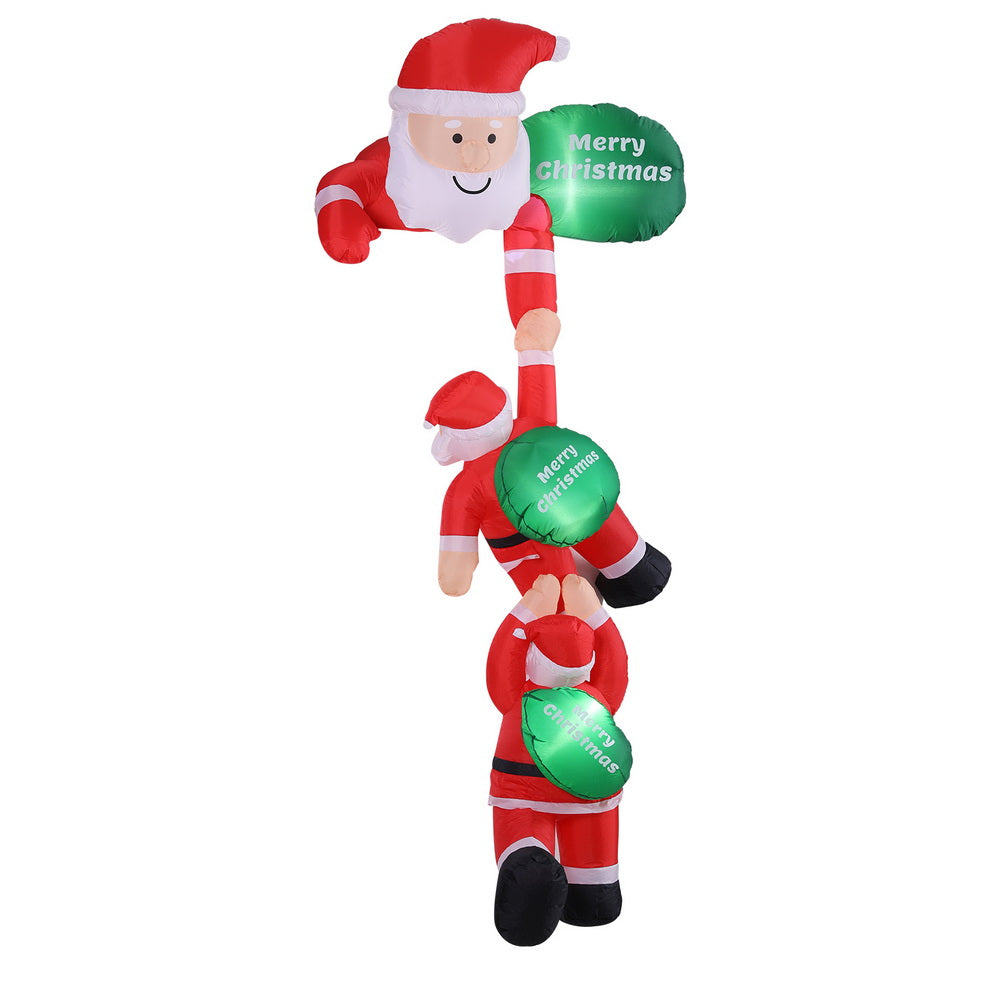 Christmas inflatable climbing Santa with green glowing “Merry Christmas” balloons and LED lights