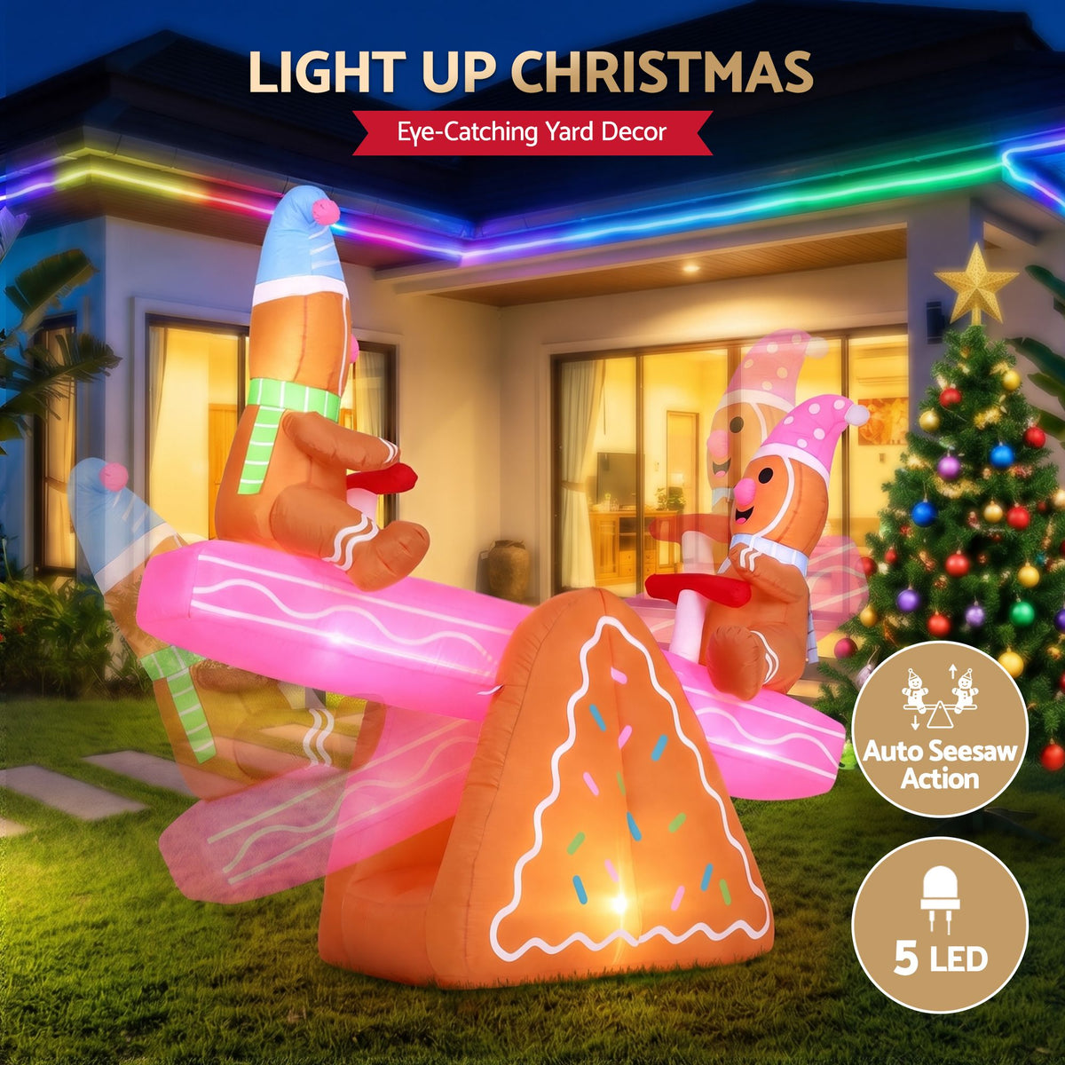 LED inflatable Christmas seesaw with two elf figures, glowing orange base and pink runners outdoors