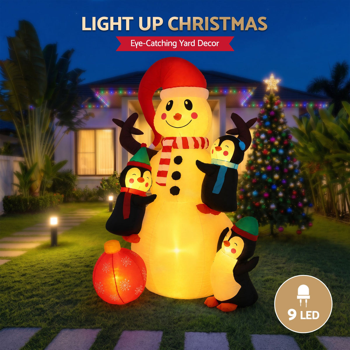 Warm-lit inflatable snowman with red hat, striped scarf, and penguin friends holding gifts