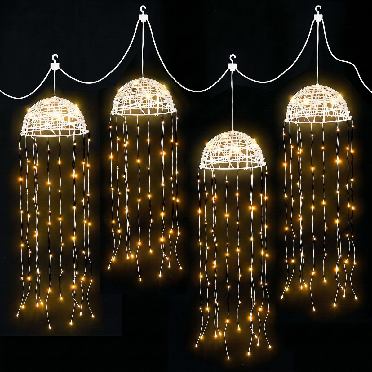Solar jellyfish string lights with four glowing dome lanterns and warm white dangling LEDs