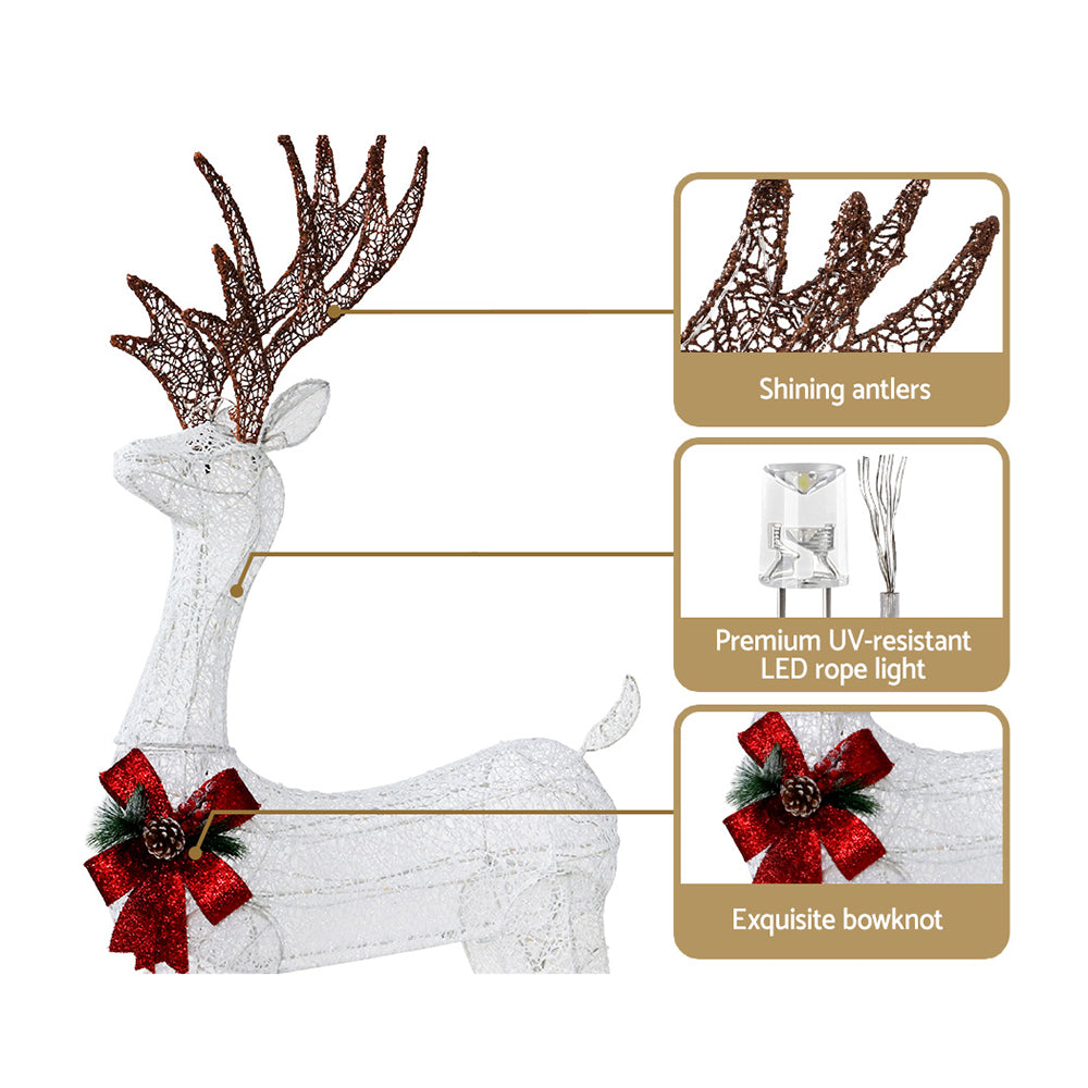 White reindeer decoration with red bow, UV-resistant LEDs, shining antlers