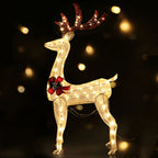 Lighted gold reindeer decoration with red bow and glowing antlers, standing