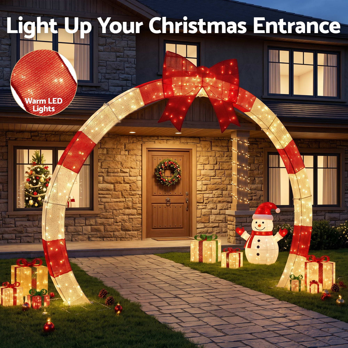 Pre-lit Christmas arch with red LED bow and warm white light tubing for outdoor entrance