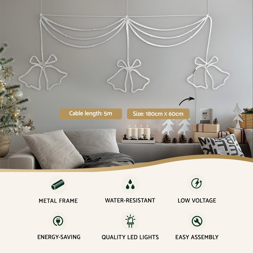 White LED bell curtain light with three bell-bow motifs; water-resistant, low voltage notes
