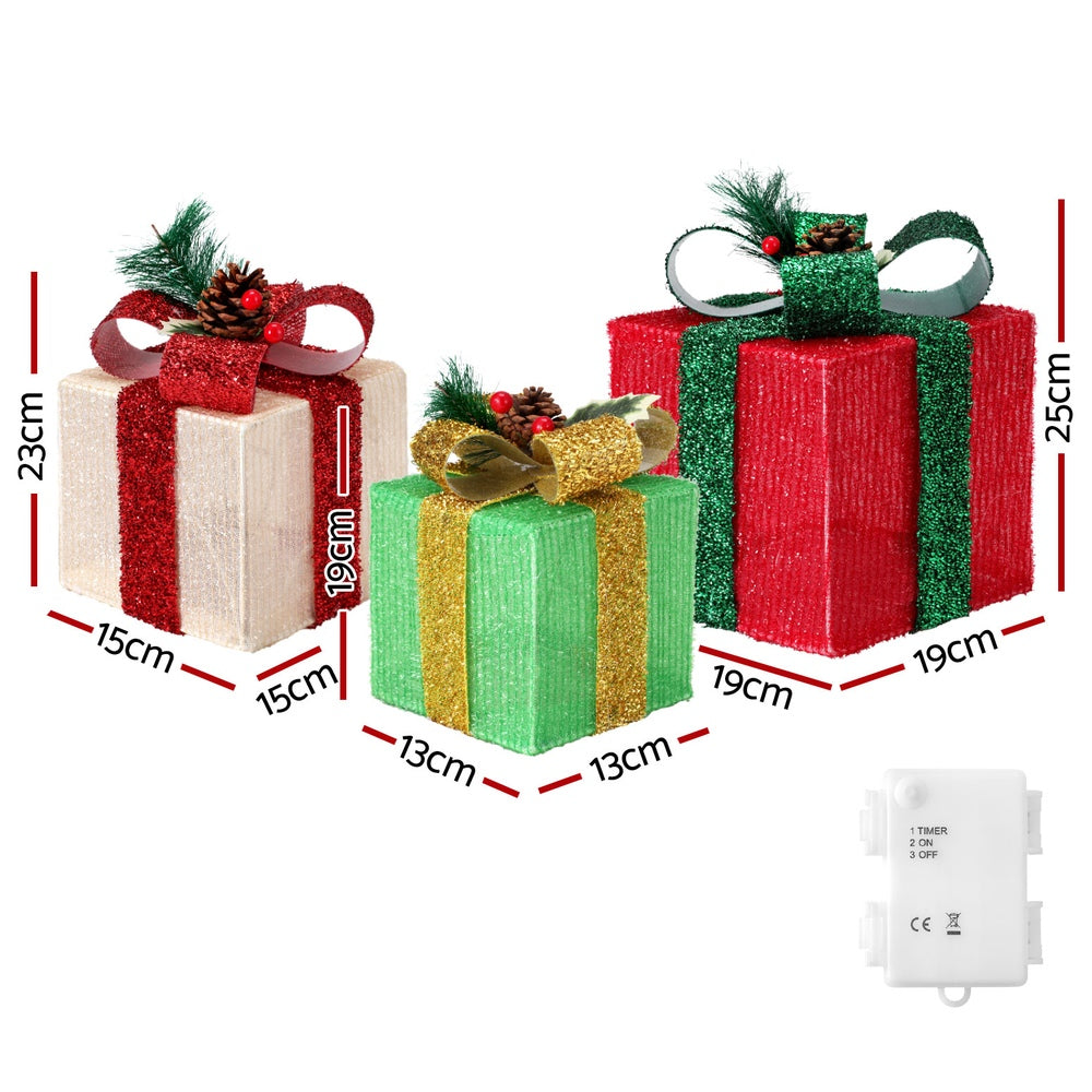 Three lit Christmas gift boxes with warm white lights and battery box with timer