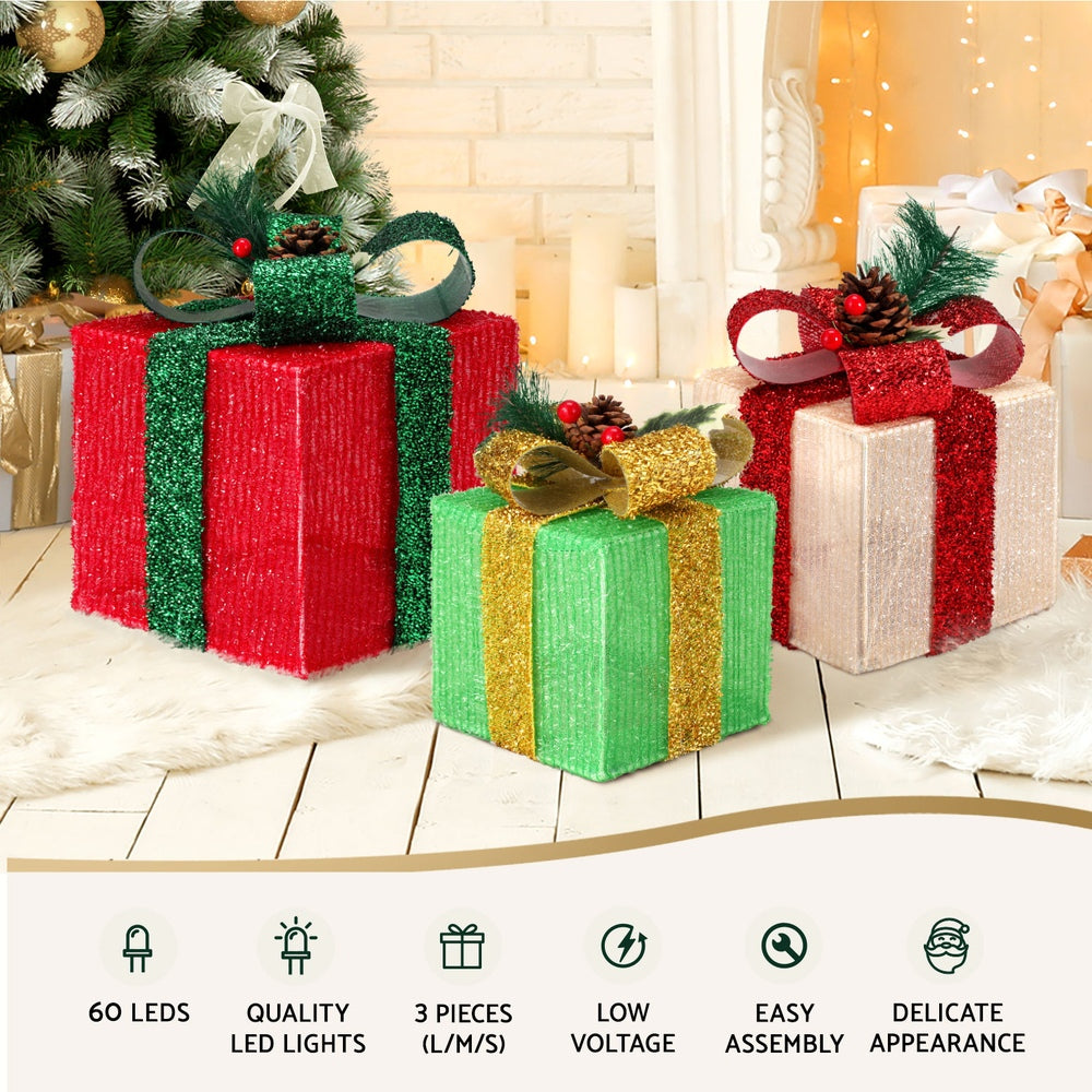 Three Christmas gift box lights with warm white bulbs and ribboned fabric coverings