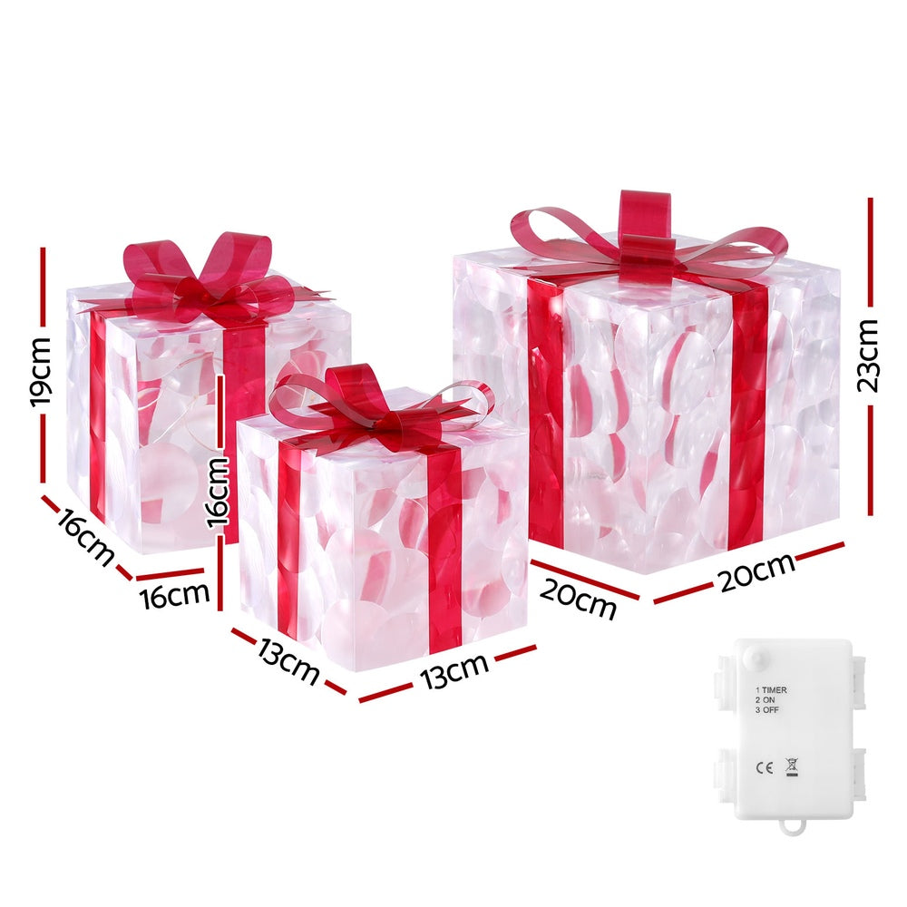 3 clear gift boxes with red bows and warm LED string light, with dimensions shown