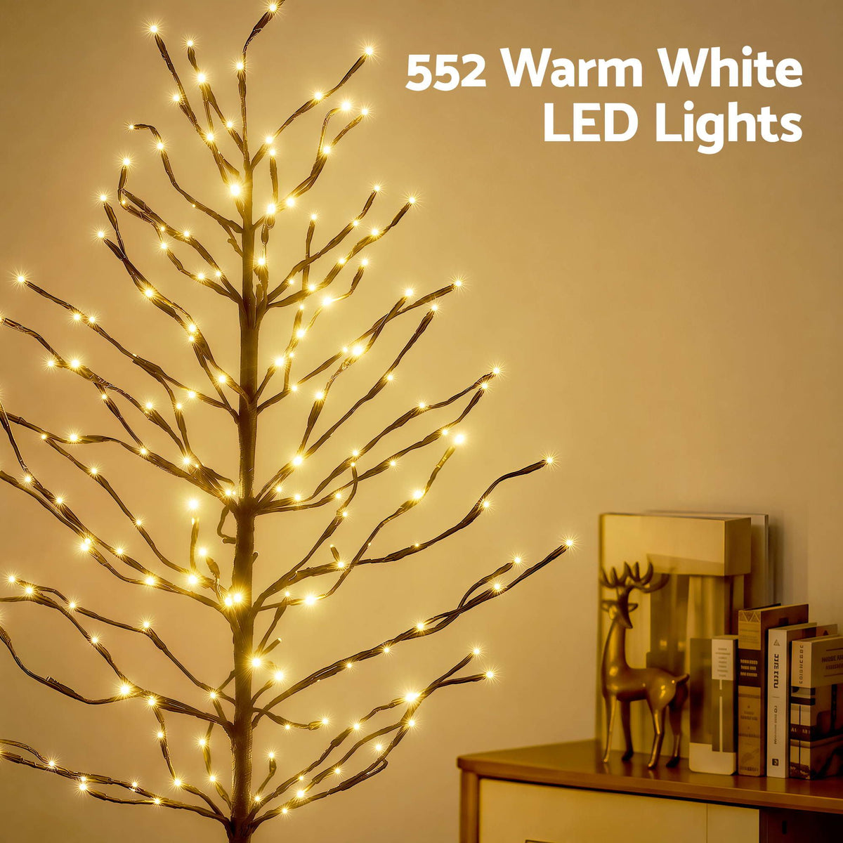 Warm white LED lit Christmas tree with illuminated branch tips and black trunk