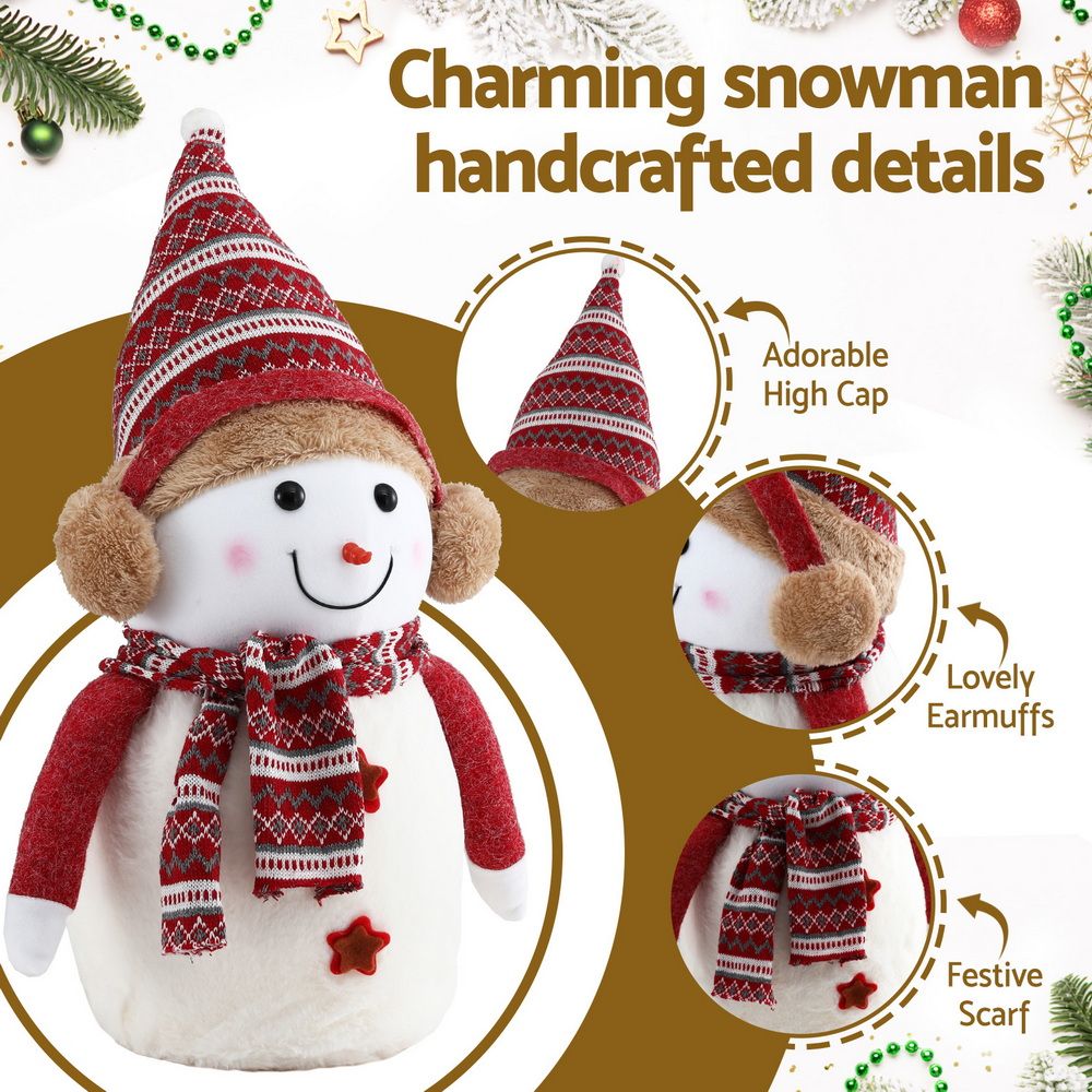 Red-and-white plush snowman with knit hat, earmuffs, scarf, and red star details