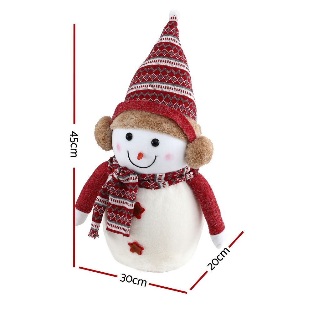 Plush red-and-white snowman tabletop decoration, front view with knit hat and scarf