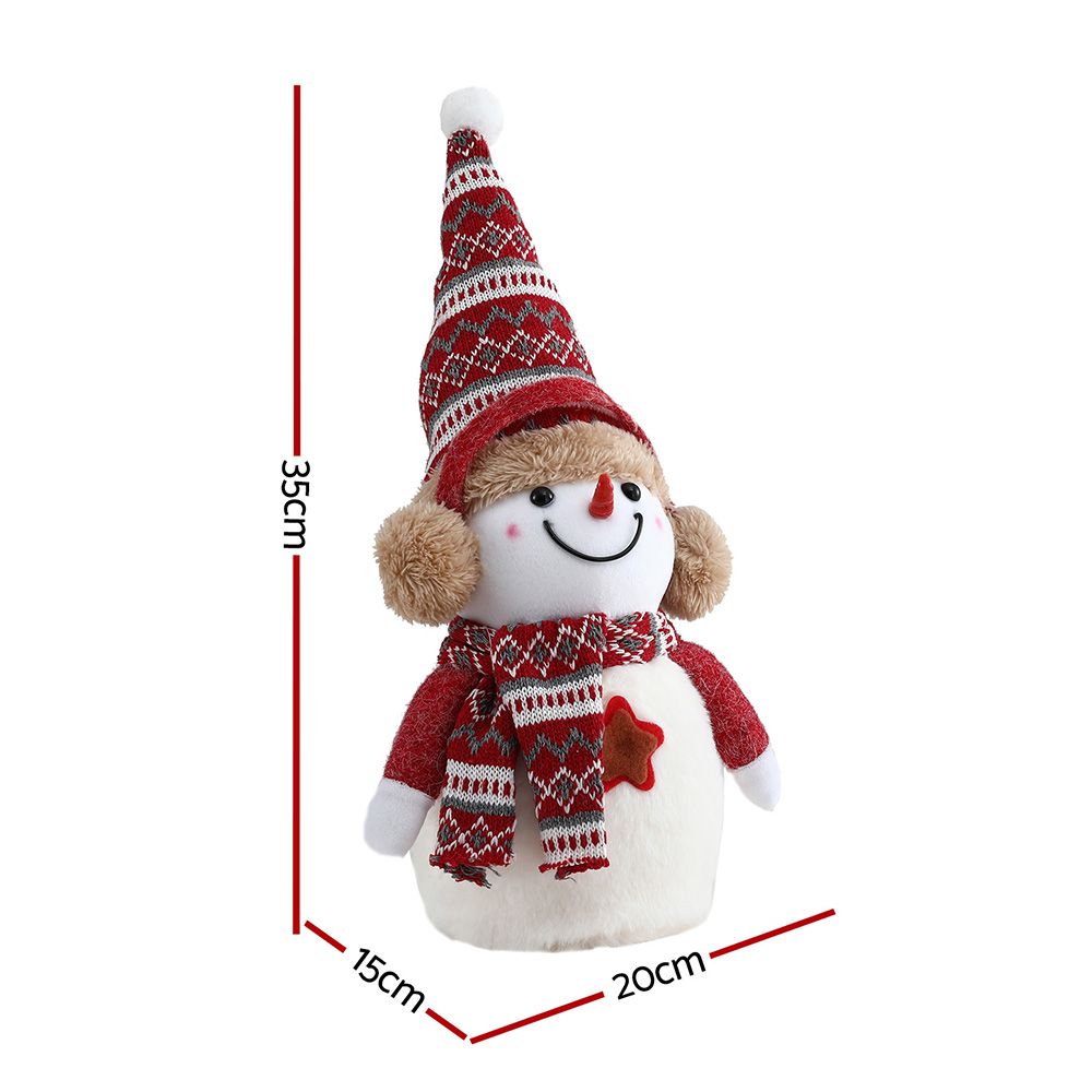 Plush snowman decoration with tall red patterned hat, round white body, and striped scarf